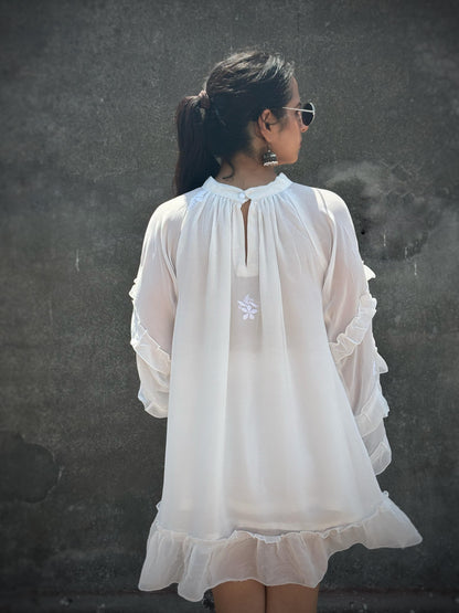 Adaa off-white Chikankari ruffle mini dress — back view, keyhole button, ruffle sleeves