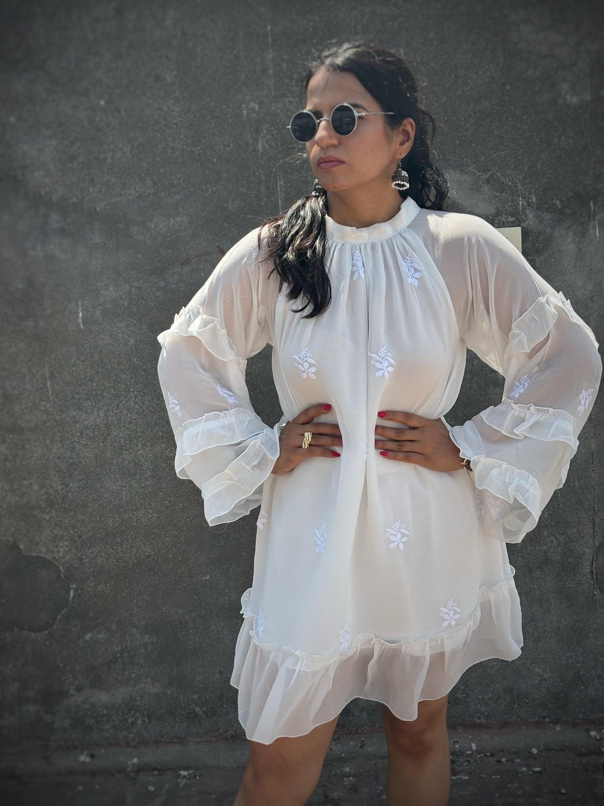Adaa off-white Chikankari ruffle mini dress — front view with pose, three-tier ruffle sleeves