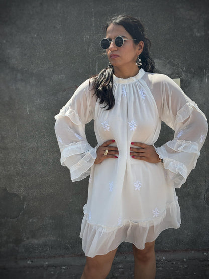 Adaa off-white Chikankari ruffle mini dress — front view with pose, three-tier ruffle sleeves