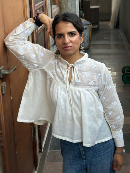 Mehr off-white Chikankari yoke top — lifestyle leaning against wall, everyday wear
