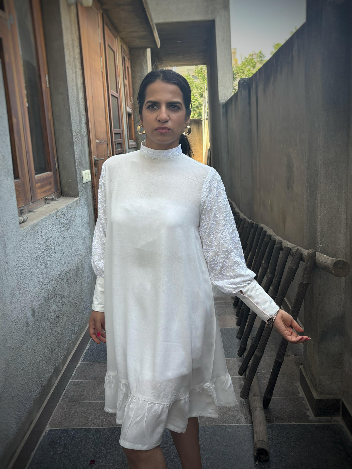 Nazaakat off-white Chikankari midi dress — front left side view, bishop sleeves, ruffle hem