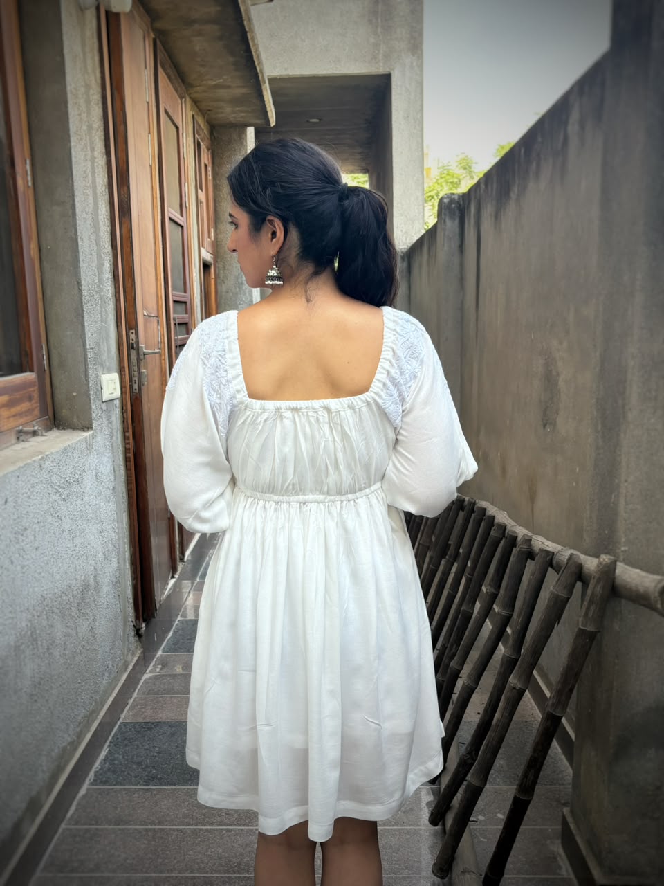 Rahat off-white Chikankari off-shoulder midi dress — back view, gathered skirt, ruffle hem