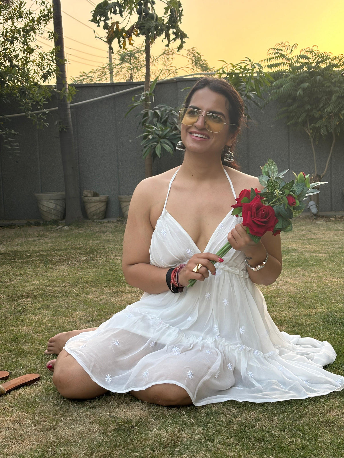 Shiddat off-white Chikankari mini dress — lifestyle - sitting in park, evening and occasion wear
